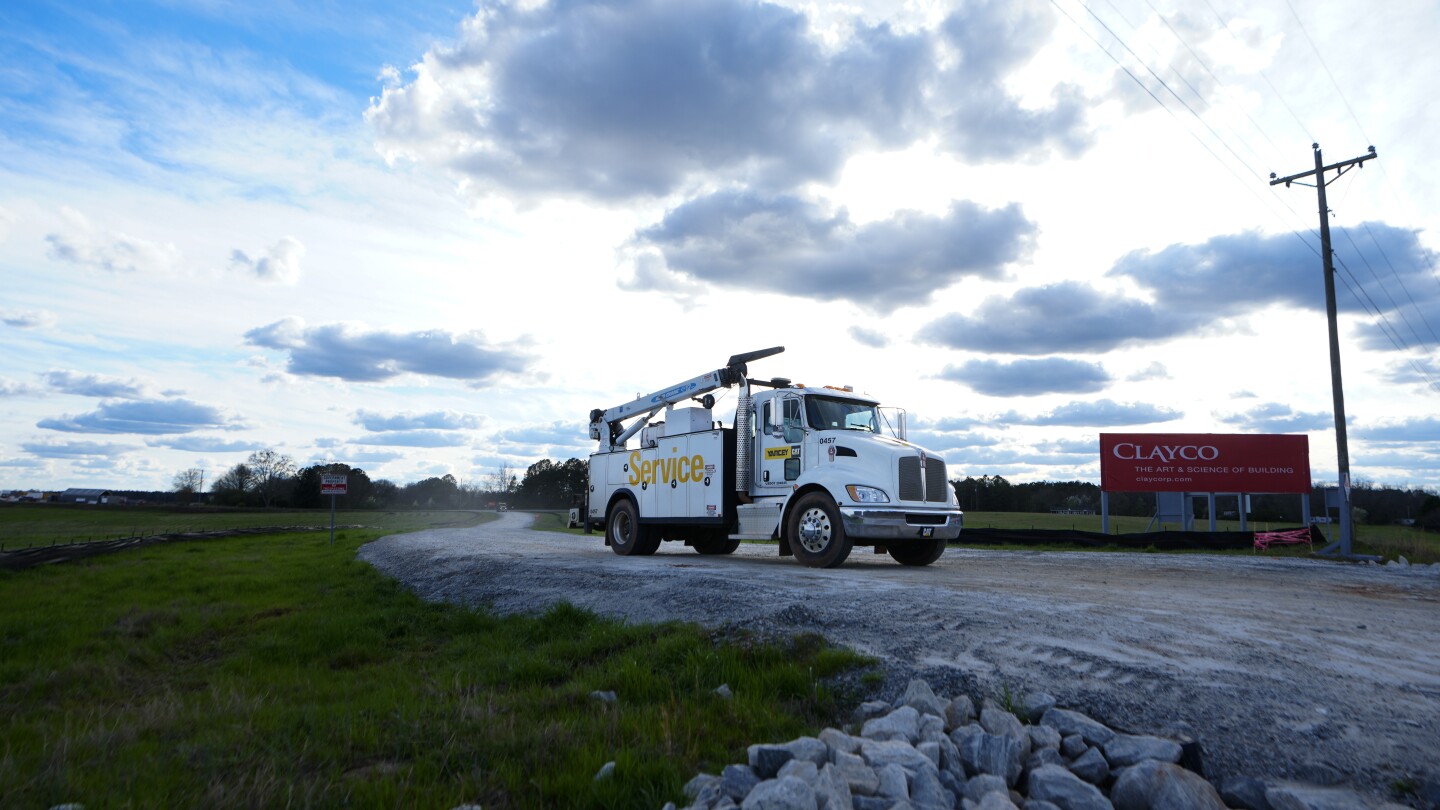 Featured image for Rivian Halts $5 Billion Electric Truck Plant Construction, Unveils Affordable EV Models