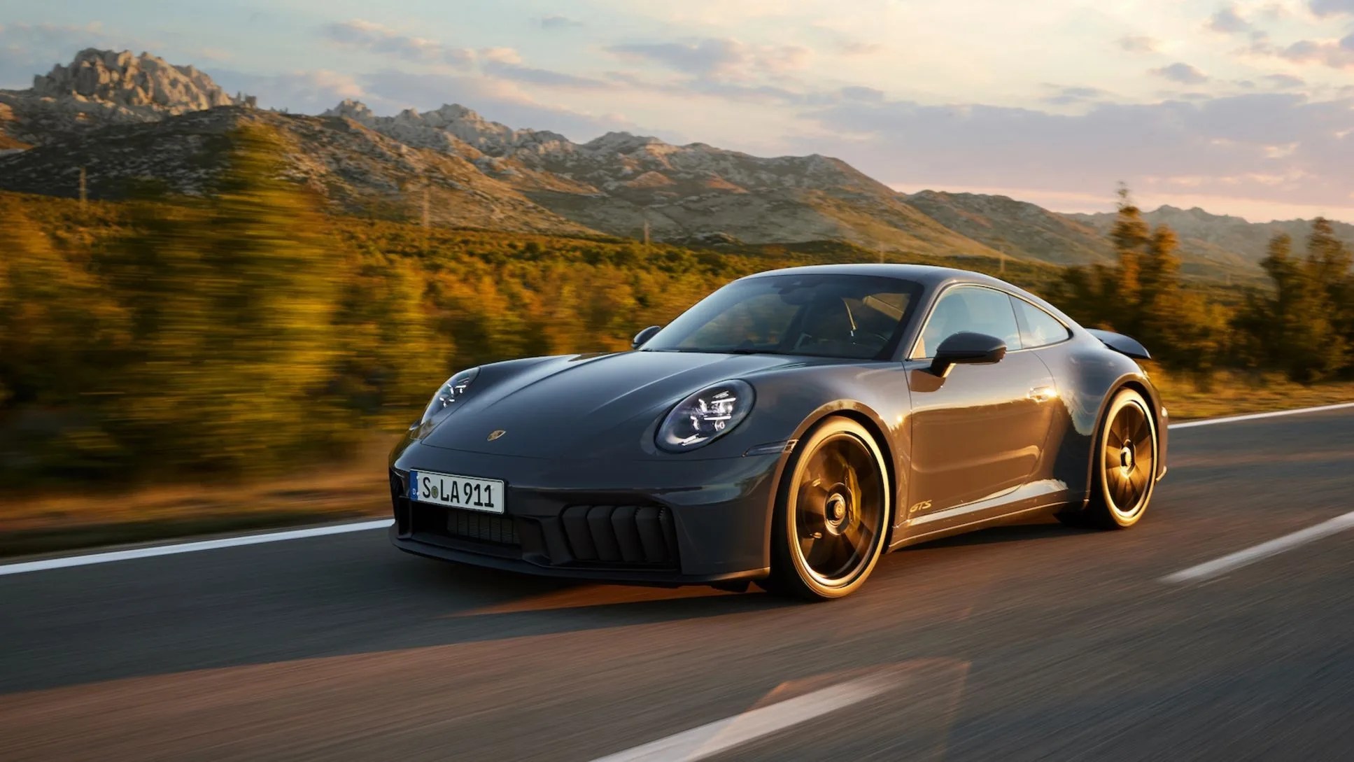 Featured image for "Porsche Unveils Hybrid 911, Shedding Iconic Feature"