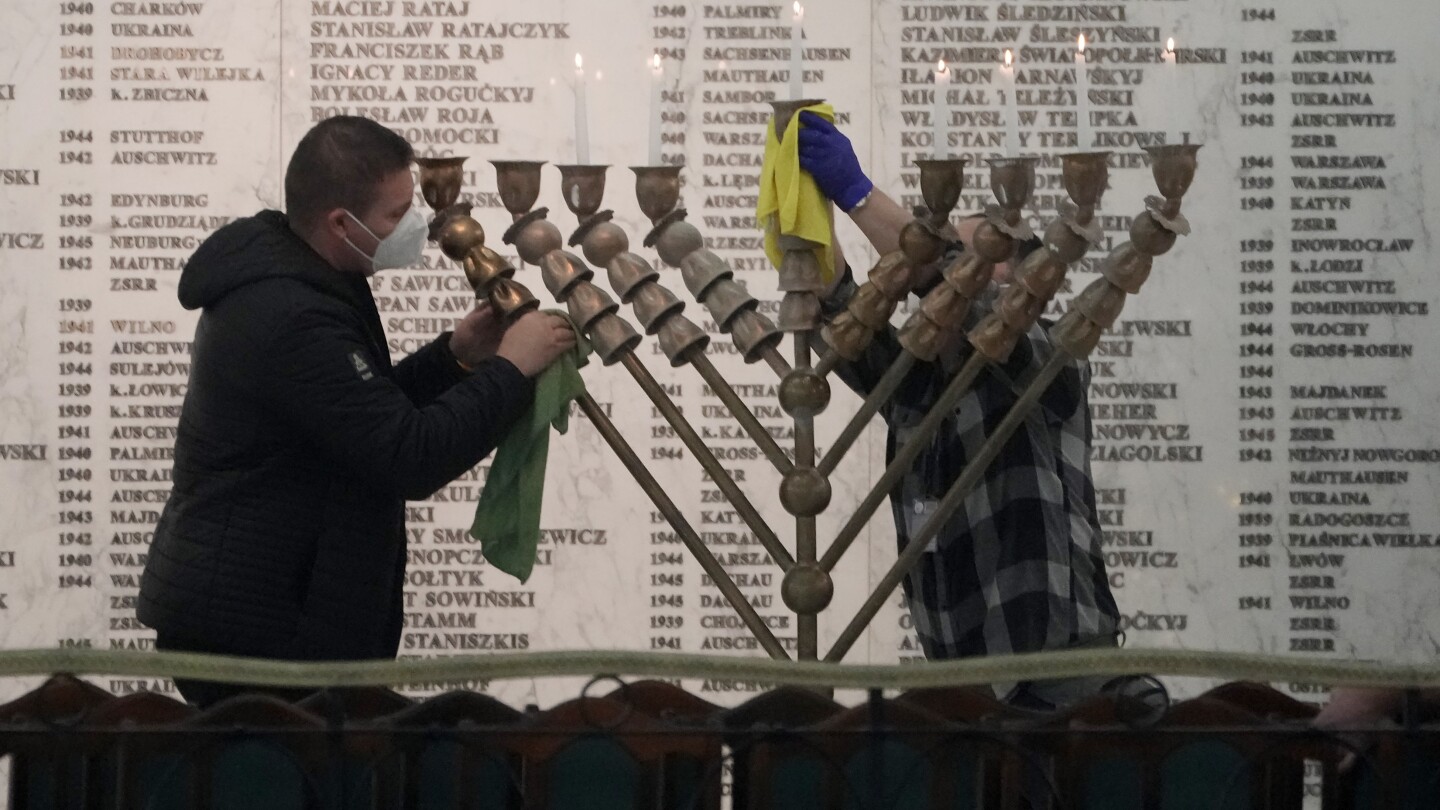 Far-right Polish MP extinguishes Hanukkah candles in parliament