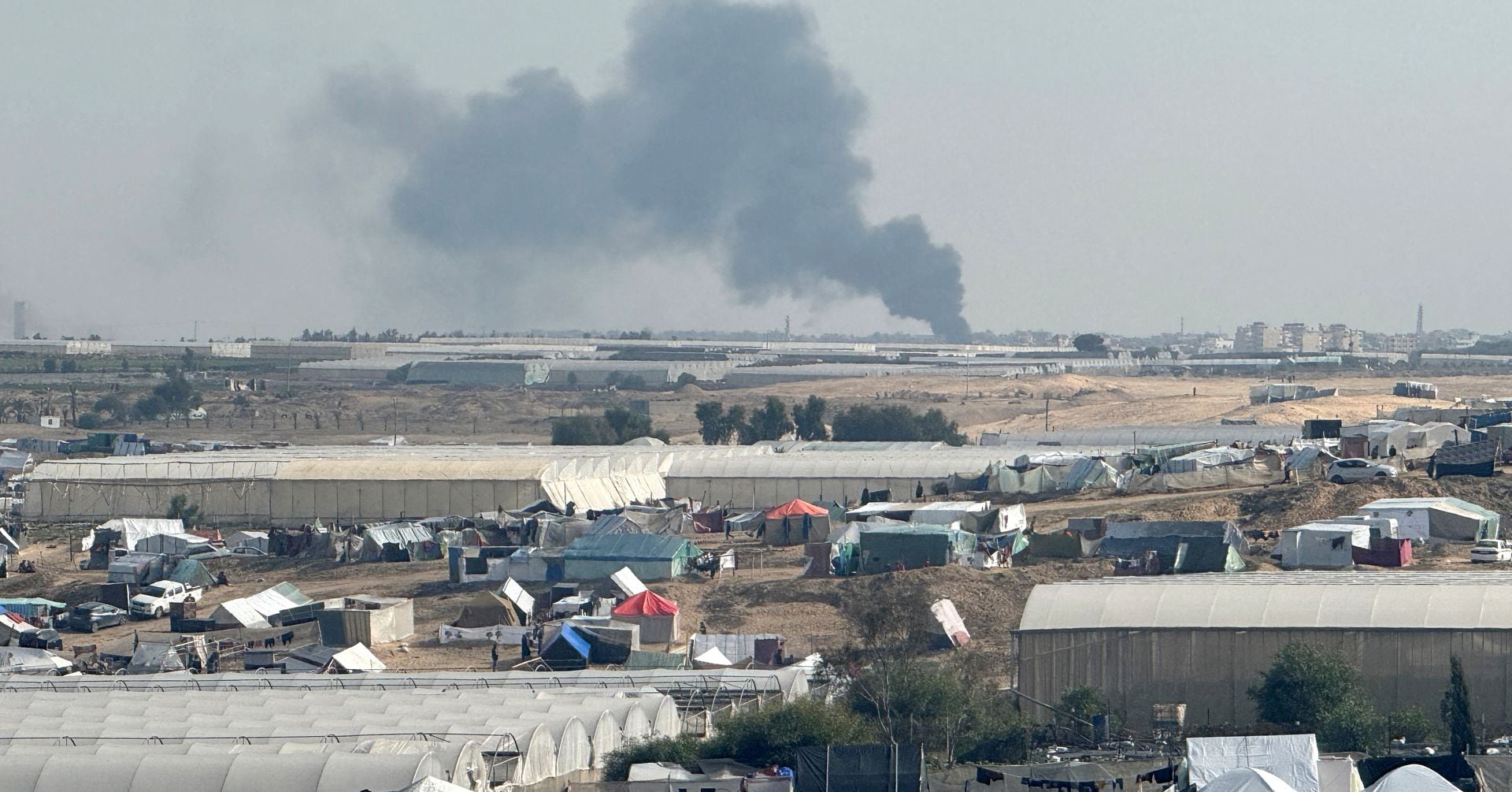 "Israeli Tanks Pound Hospital Districts in South Gaza as Residents Flee Chaotic Aid Distribution"