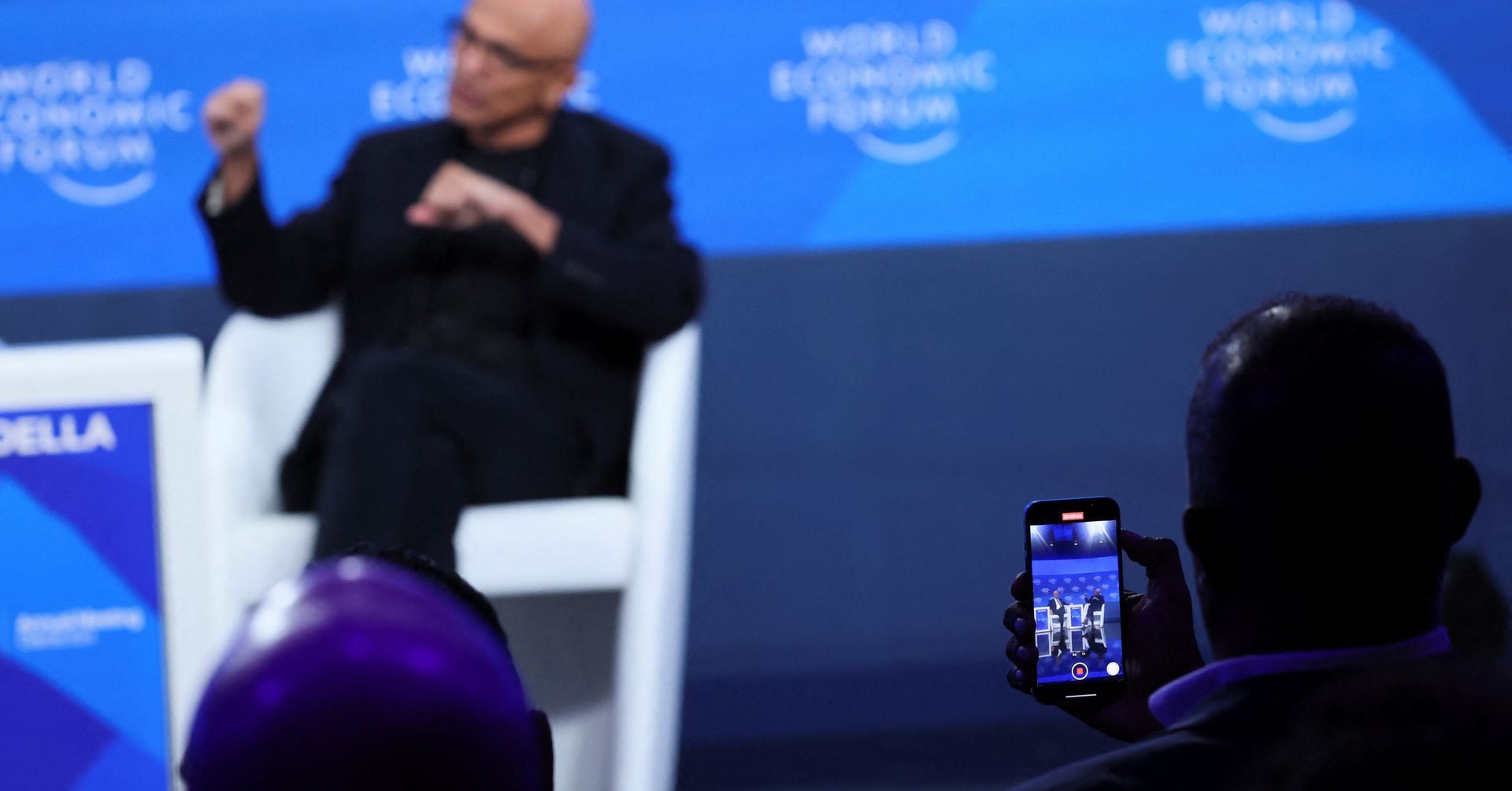 "Davos CEOs Grapple with AI's Potential for Profit and Peril"