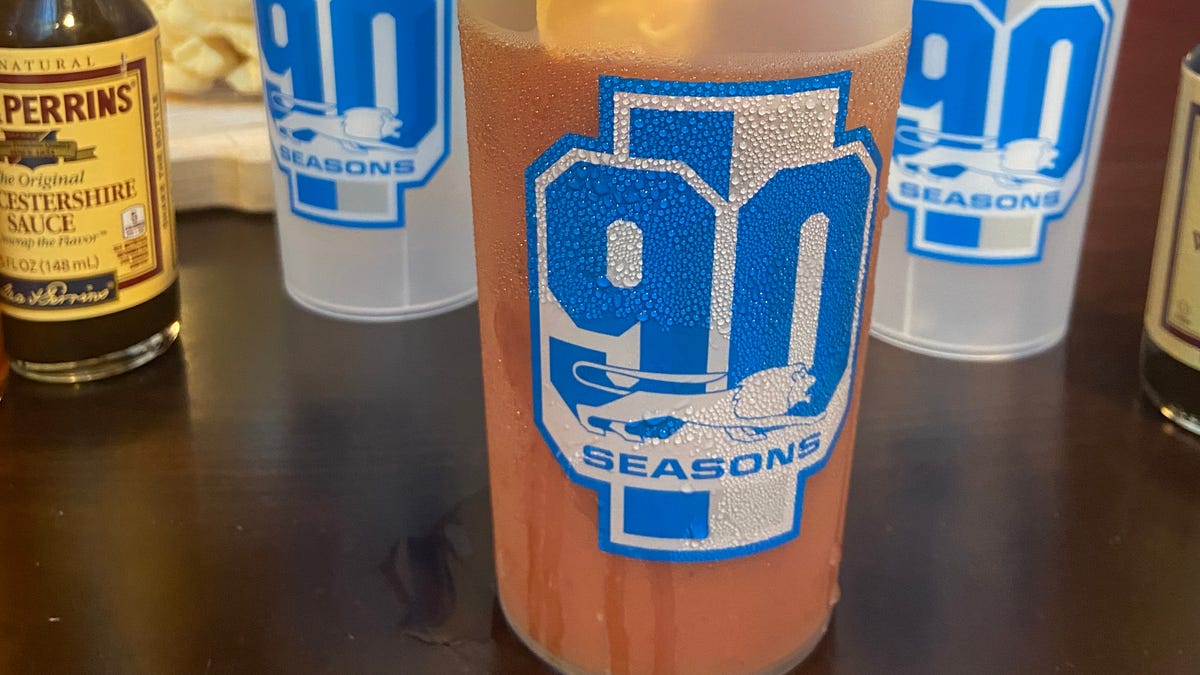 "Ford Field's Playoff Atmosphere: Uniforms, Security, and Fan Anticipation"