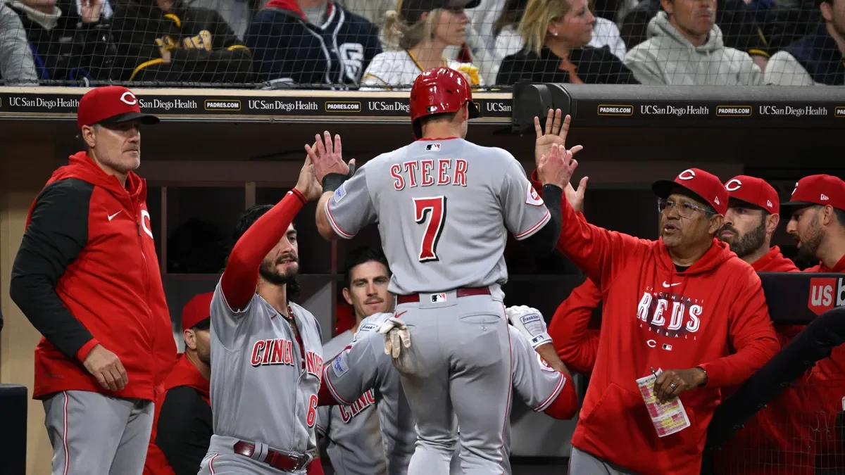 "Fraley's clutch hitting leads Reds to victory over Marlins"