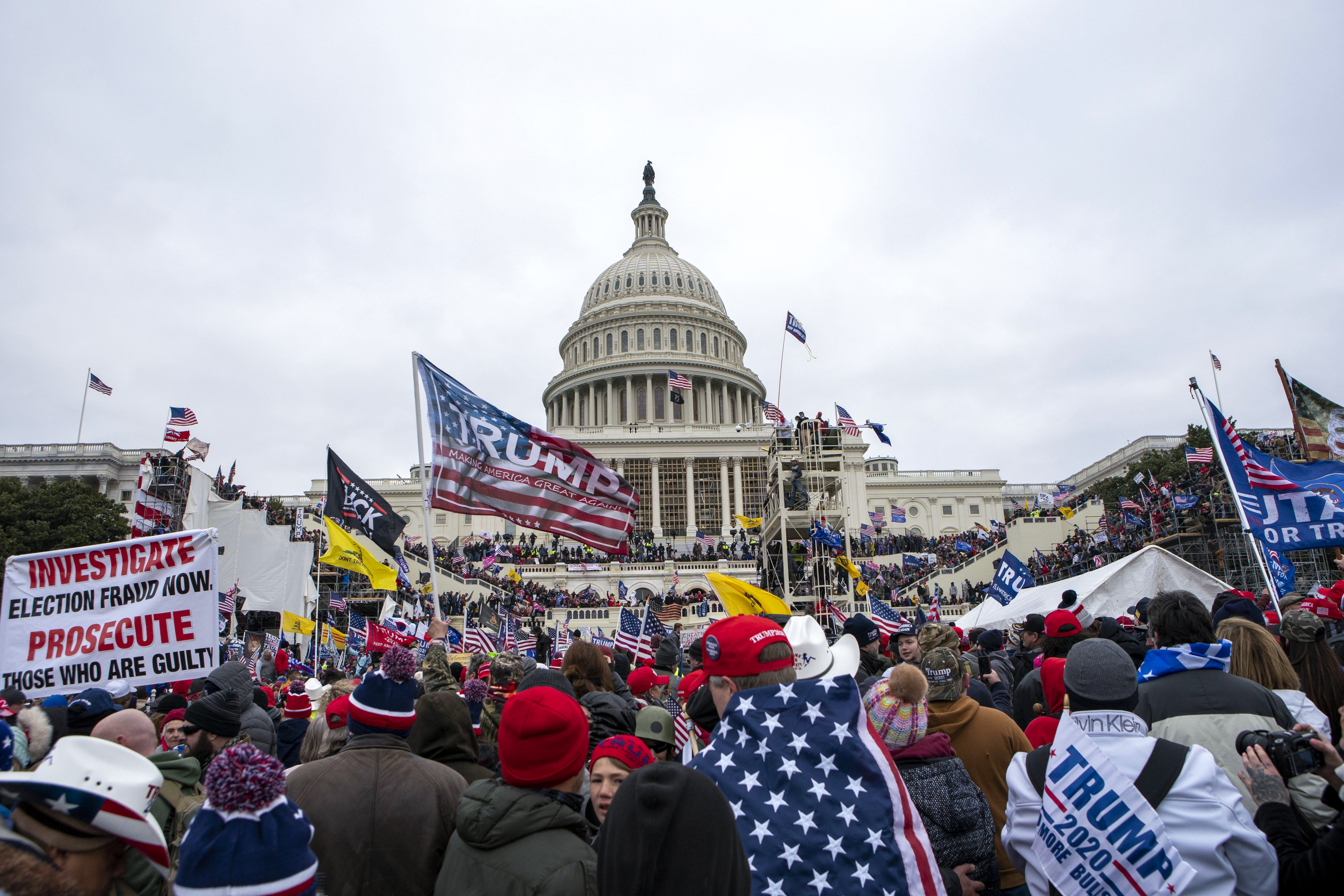 D.C. police officer charged with obstruction over Proud Boys contacts.