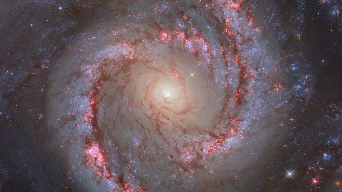 Hubble Telescope Captures Mesmerizing Dance of Spiral Galaxy