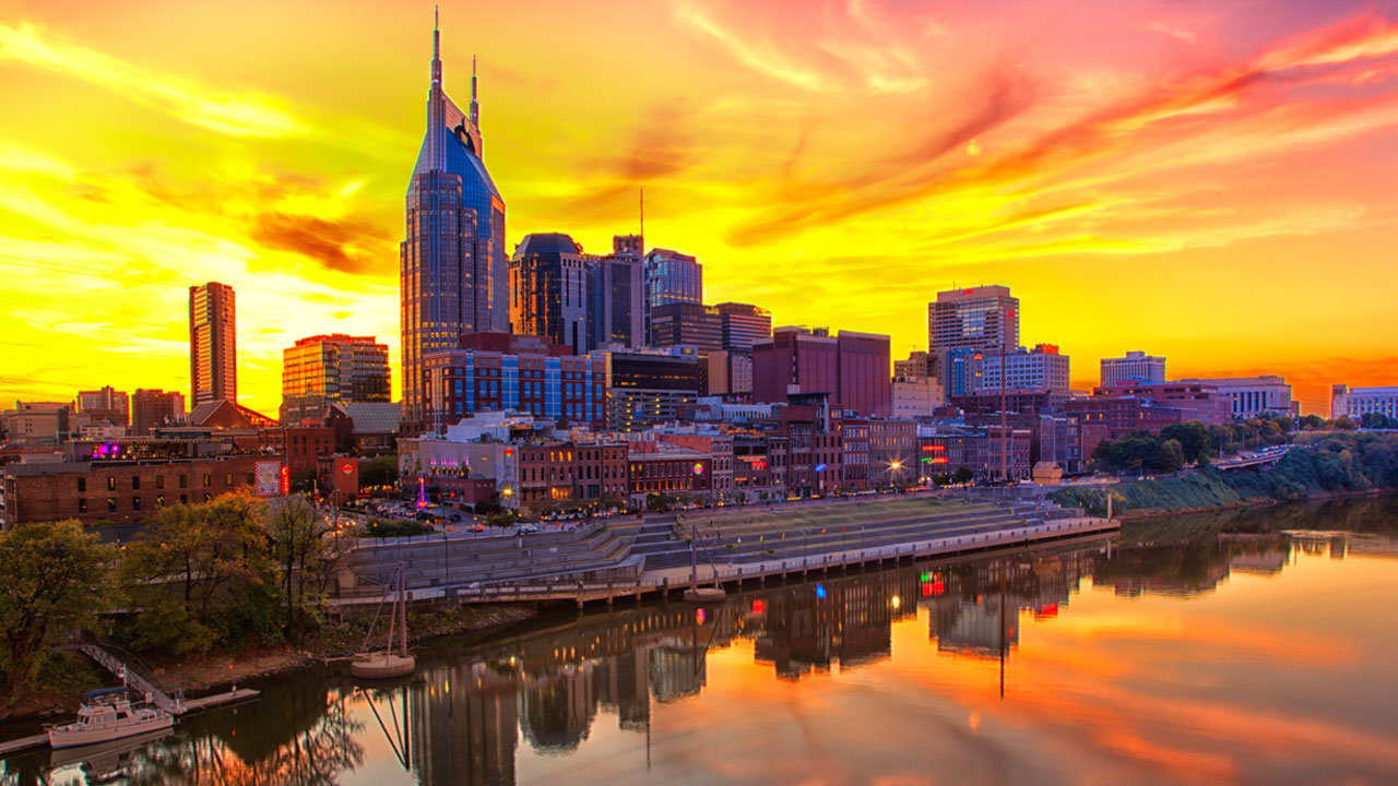 Taylor Swift's Nashville concerts cause hotel price surge, merchandise frenzy, and road closures.
