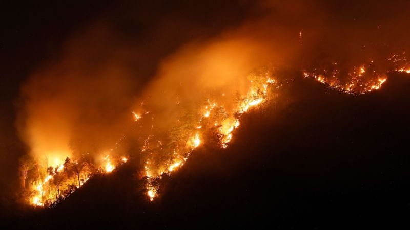 Featured image for Massive wildfire threatens Thai mountains and residential areas.