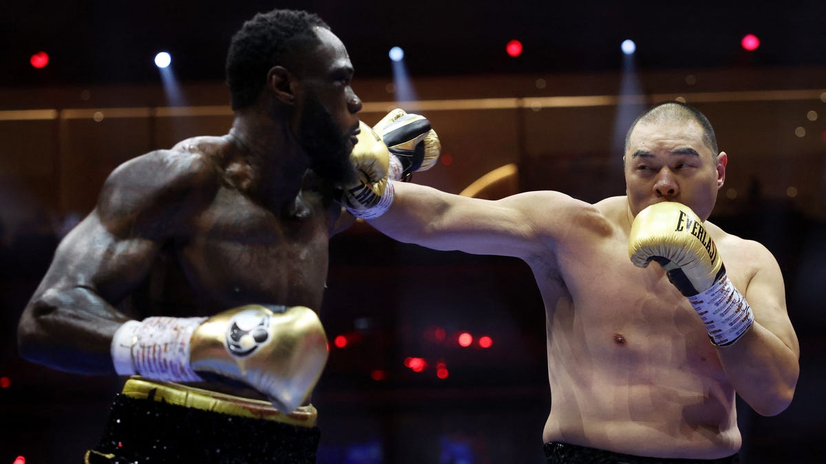 Featured image for Zhilei Zhang Stuns Deontay Wilder with 5th-Round KO Victory
