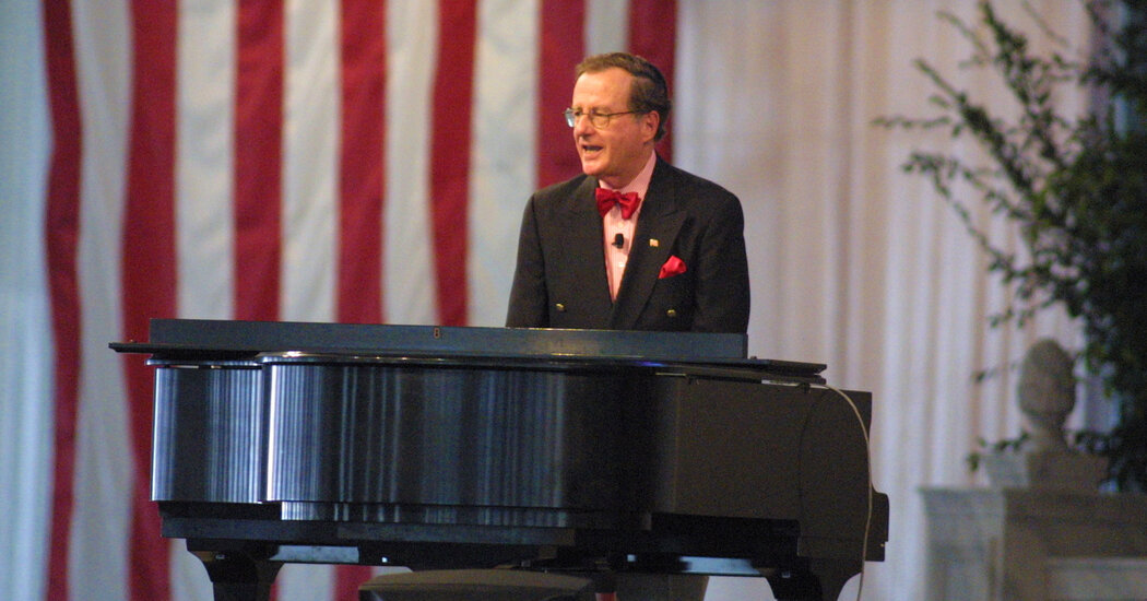 Featured image for Piano-playing political satirist Mark Russell passes away at 90.