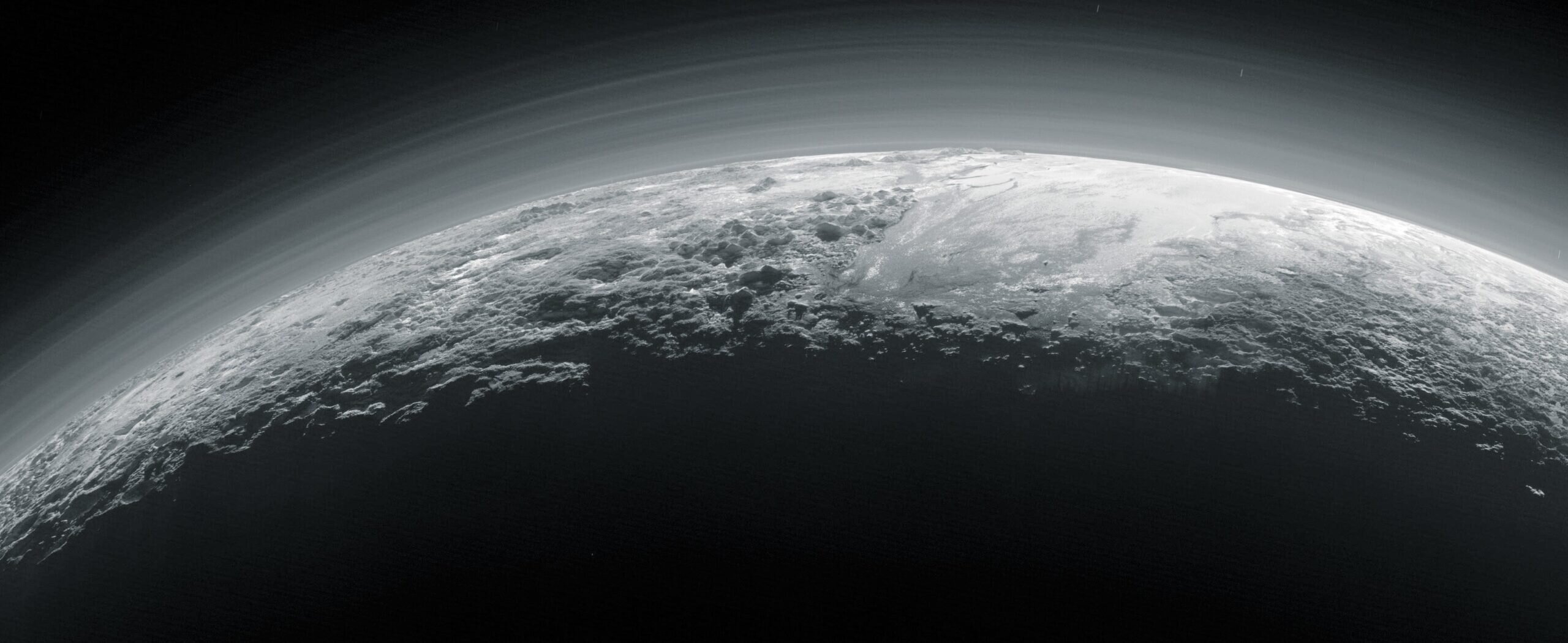 Featured image for Webb Data Confirms Pluto's Haze Has Cooling Effects
