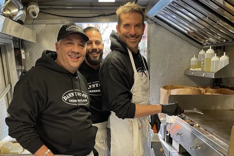 Featured image for "Bradley Cooper and Danny DiGiampietro Take on NYC's Cheesesteak Scene"