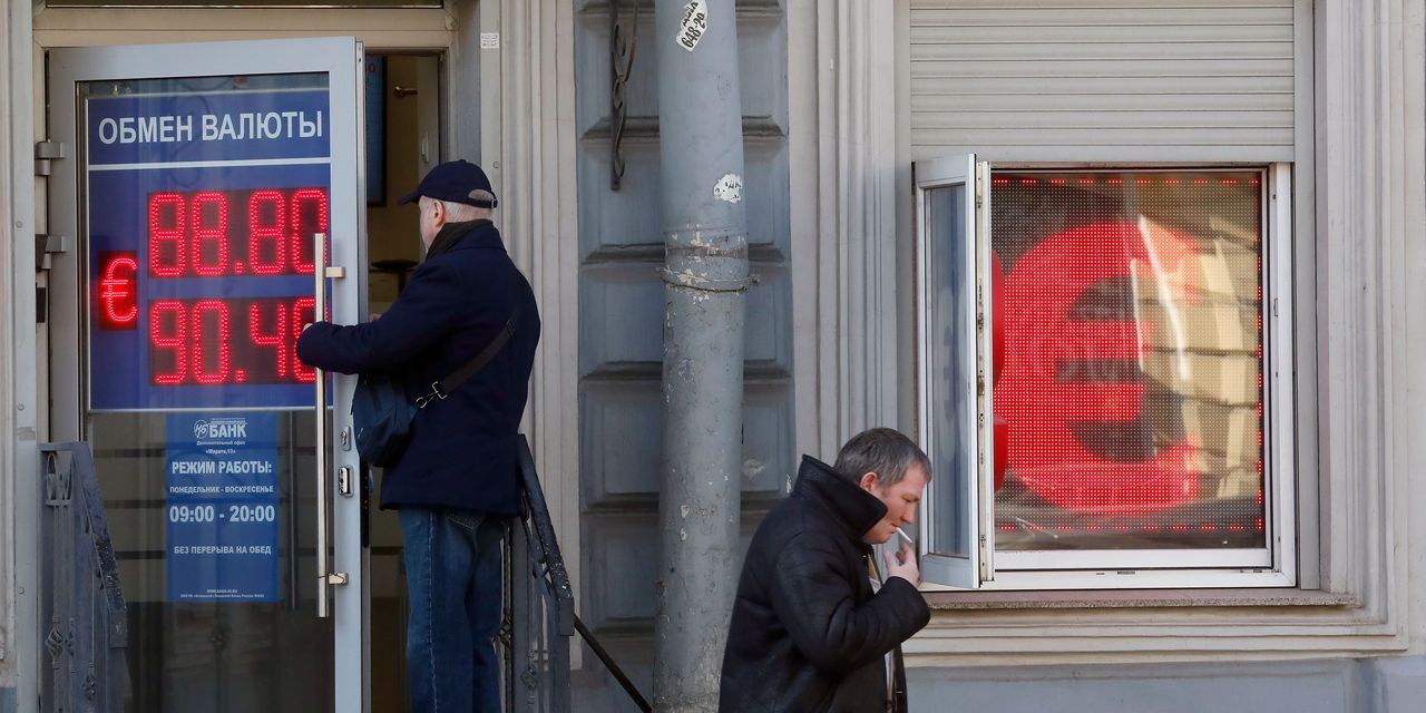 Featured image for Ruble hits one-year low amid capital flight and sanctions.