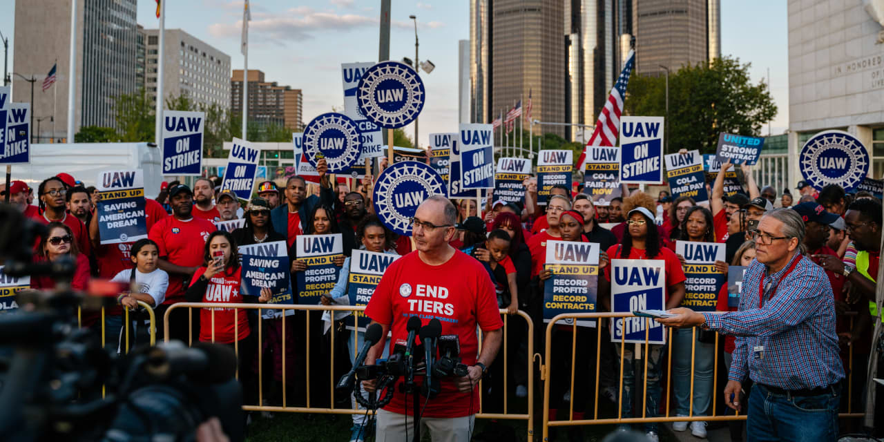 "UAW Contract Negotiations Resume Amid Auto Layoffs and Electric Vehicle Battle"