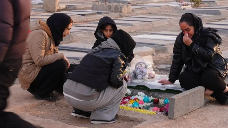 Grieving in silence beside Iran’s protest graves amid a harsh crackdown
