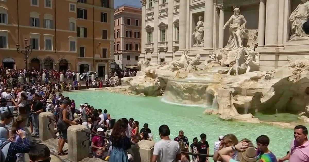 Tourist's audacious act: Climbing Rome's Trevi Fountain to quench her thirst
