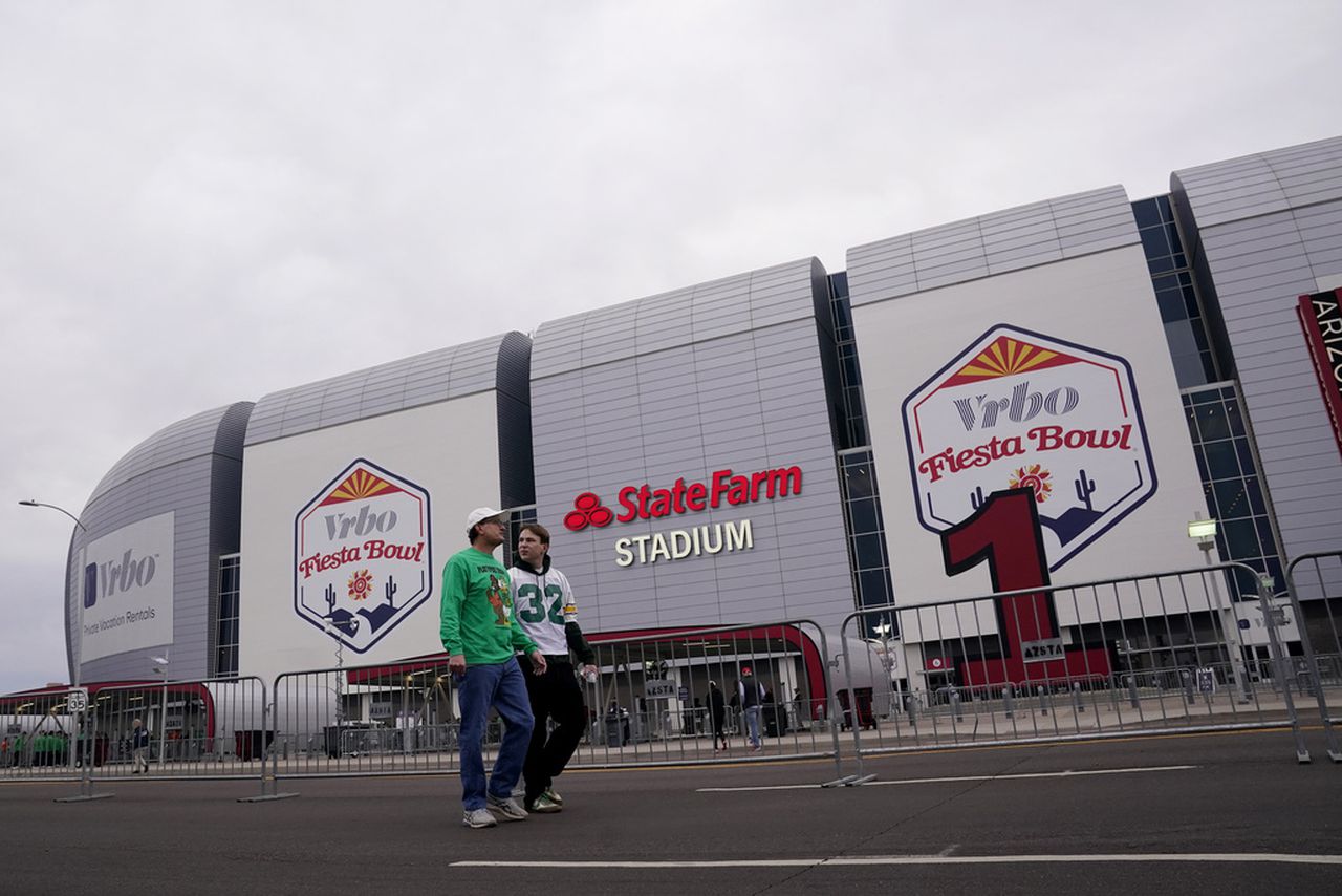 Featured image for "Fiesta Bowl Showdown: Oregon Ducks vs. Liberty Flames - Live Updates, Stream Info, and Who's Out"