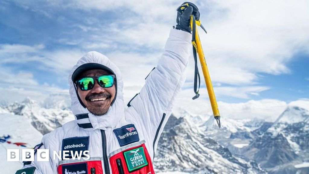 Double amputee ex-soldier makes history with Everest summit