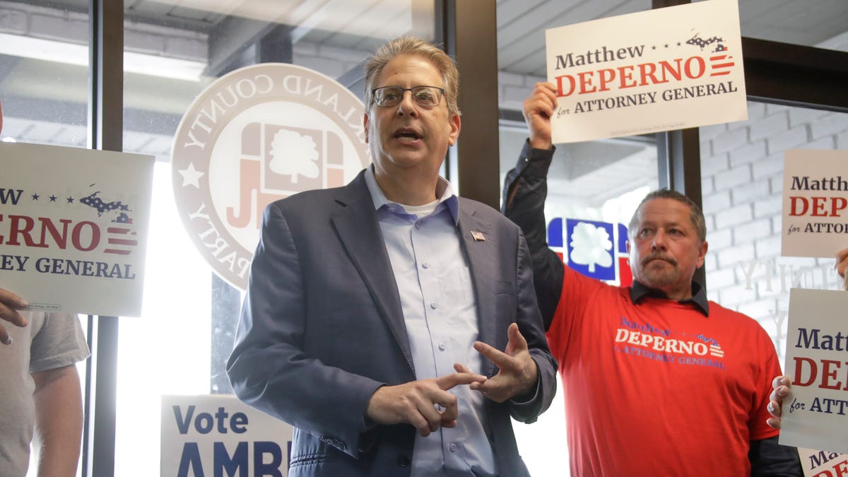 Trump allies charged in Michigan voting machine probe