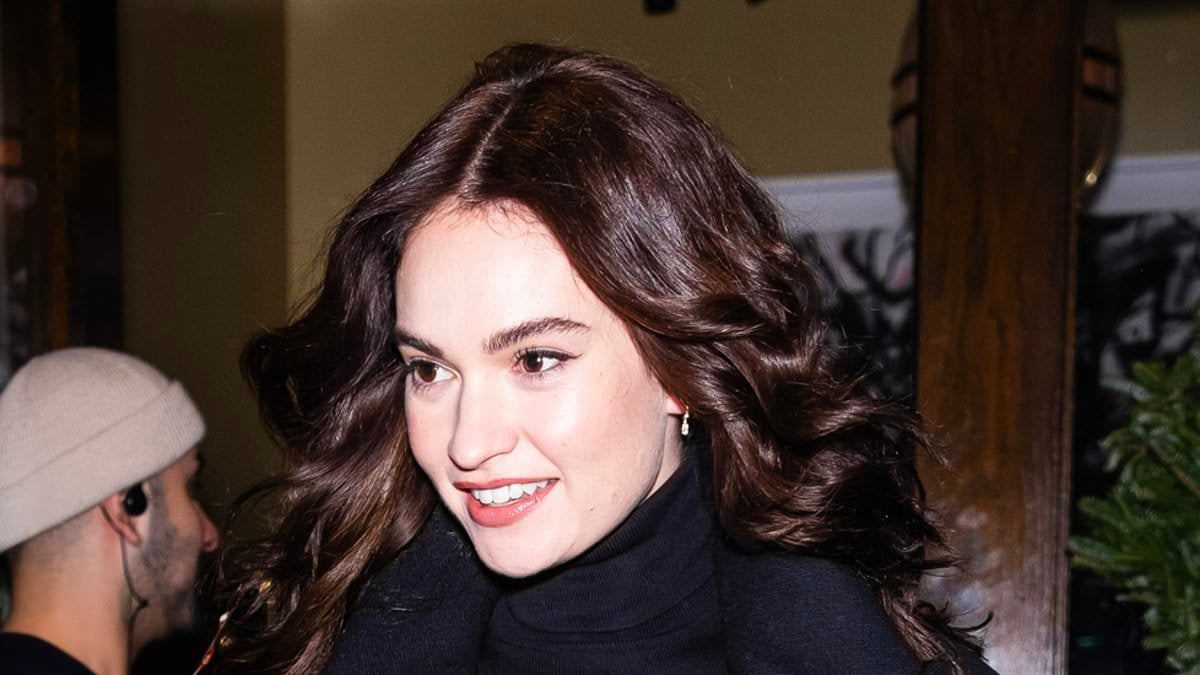 Featured image for "Lily James masters New York City style with high-waisted trousers and a tailored navy coat"