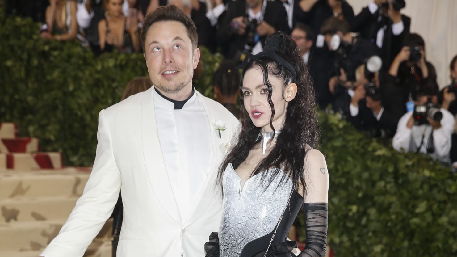 Grimes changes daughter's name to symbol of curiosity.