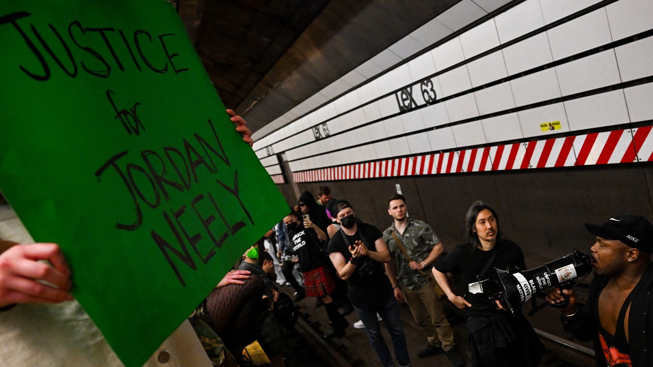 Protesters demand justice and clash with police over subway chokehold death.