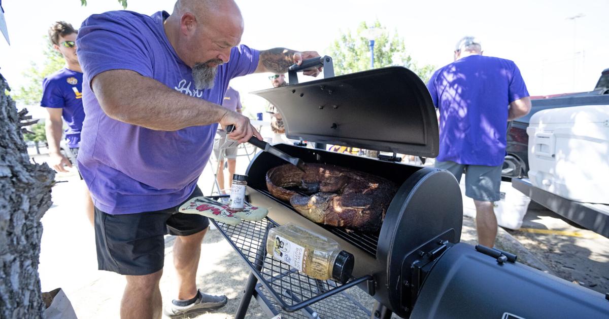 Featured image for LSU Slugger's Dad Smokes Gator in Spirit of College World Series Game.