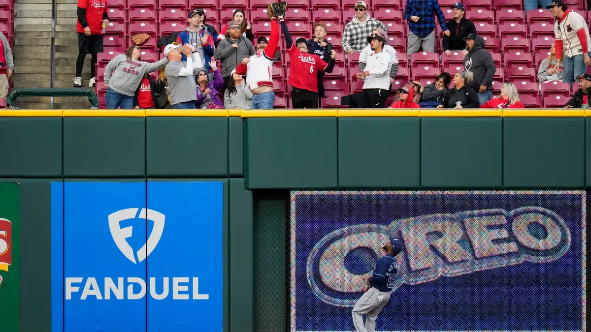 Reds break attendance record during win against Rays.