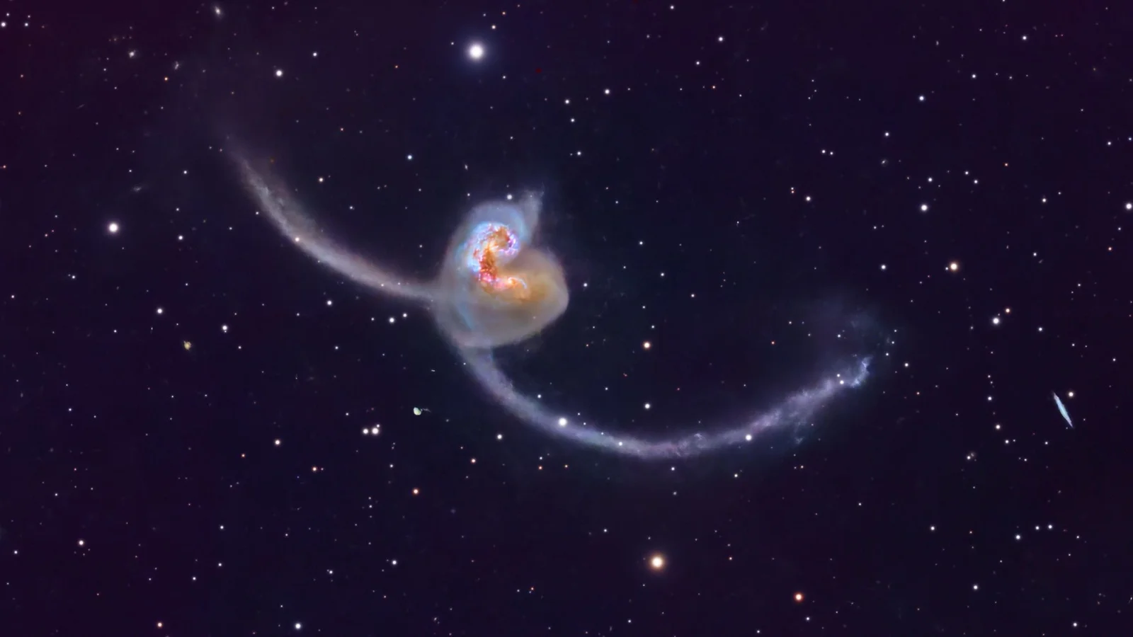 Cosmic Tug-of-War: Antennae Galaxies Dazzle in Merging Dance