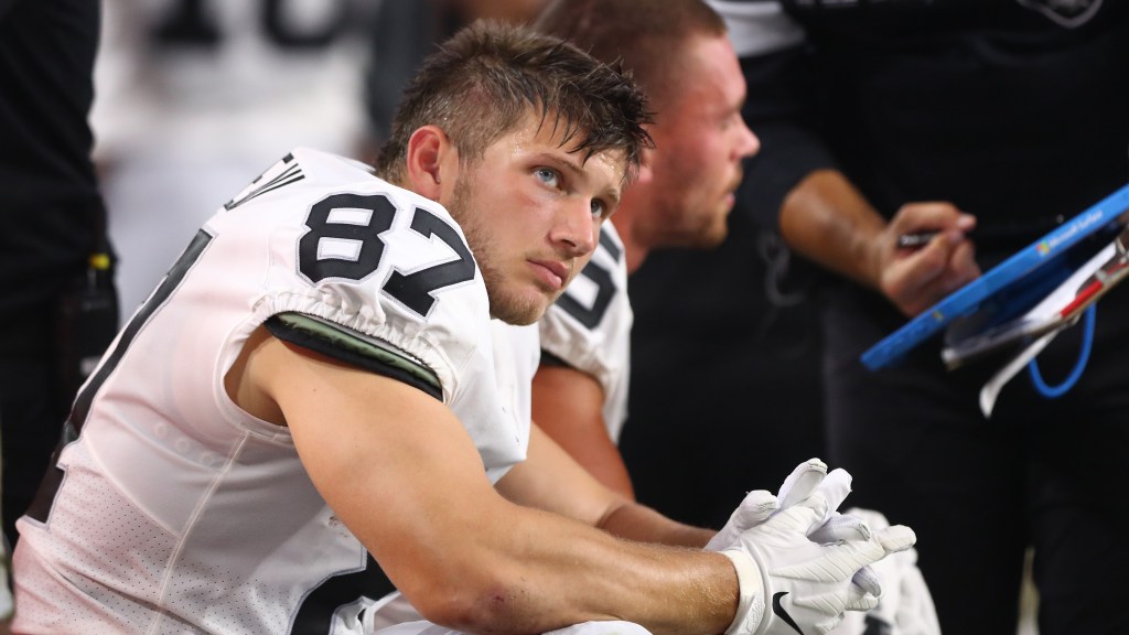 Foster Moreau joins Saints in Team Gleason shirt and Zion sneakers after cancer diagnosis.