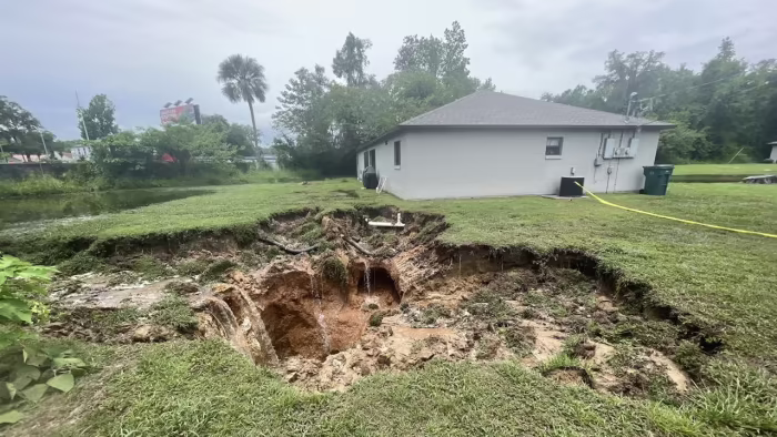 Featured image for "Ocala Home Evacuated Due to 30-Foot Hole Caused by Heavy Rainfall"