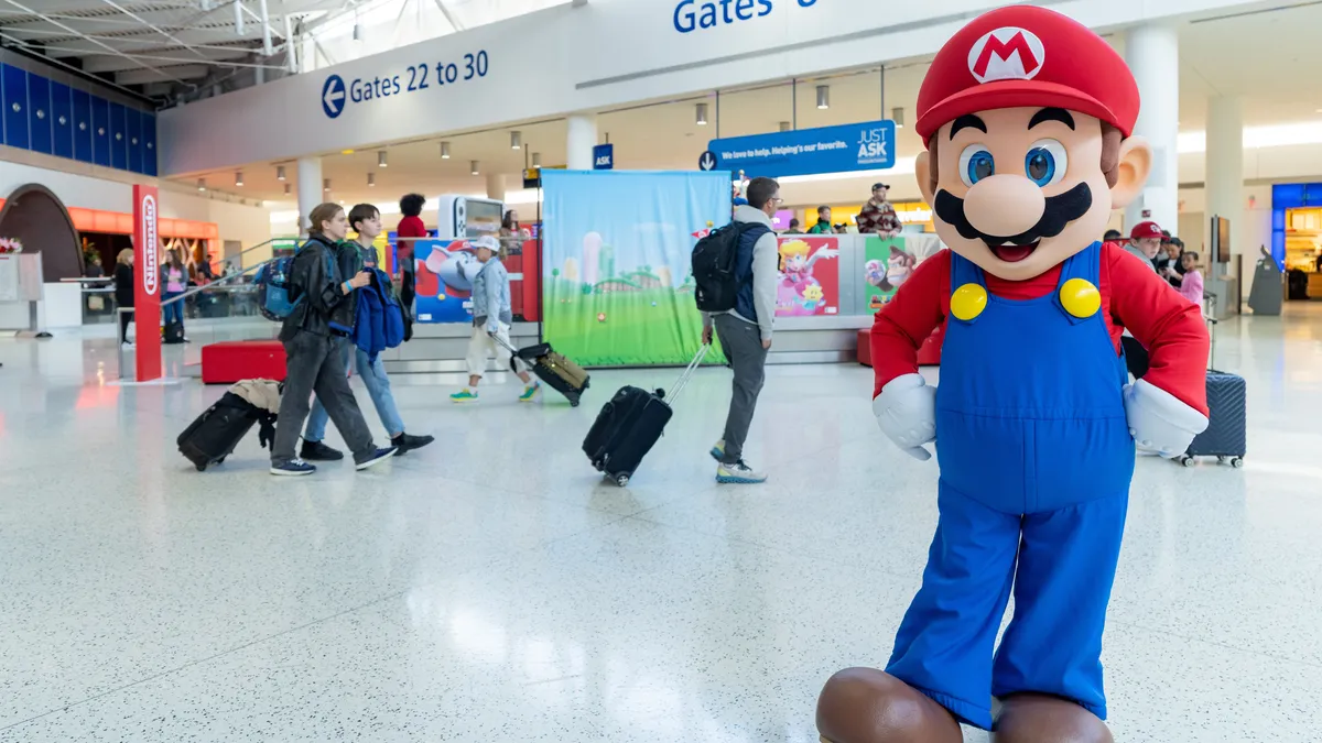 "Mario's Surprise Appearance at JFK Airport for Nintendo's Switch On-The-Go Initiative"