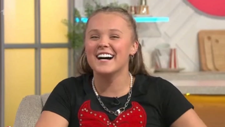 Featured image for JoJo Siwa and Chris Hughes Spark Romance Rumors with Cozy Moments