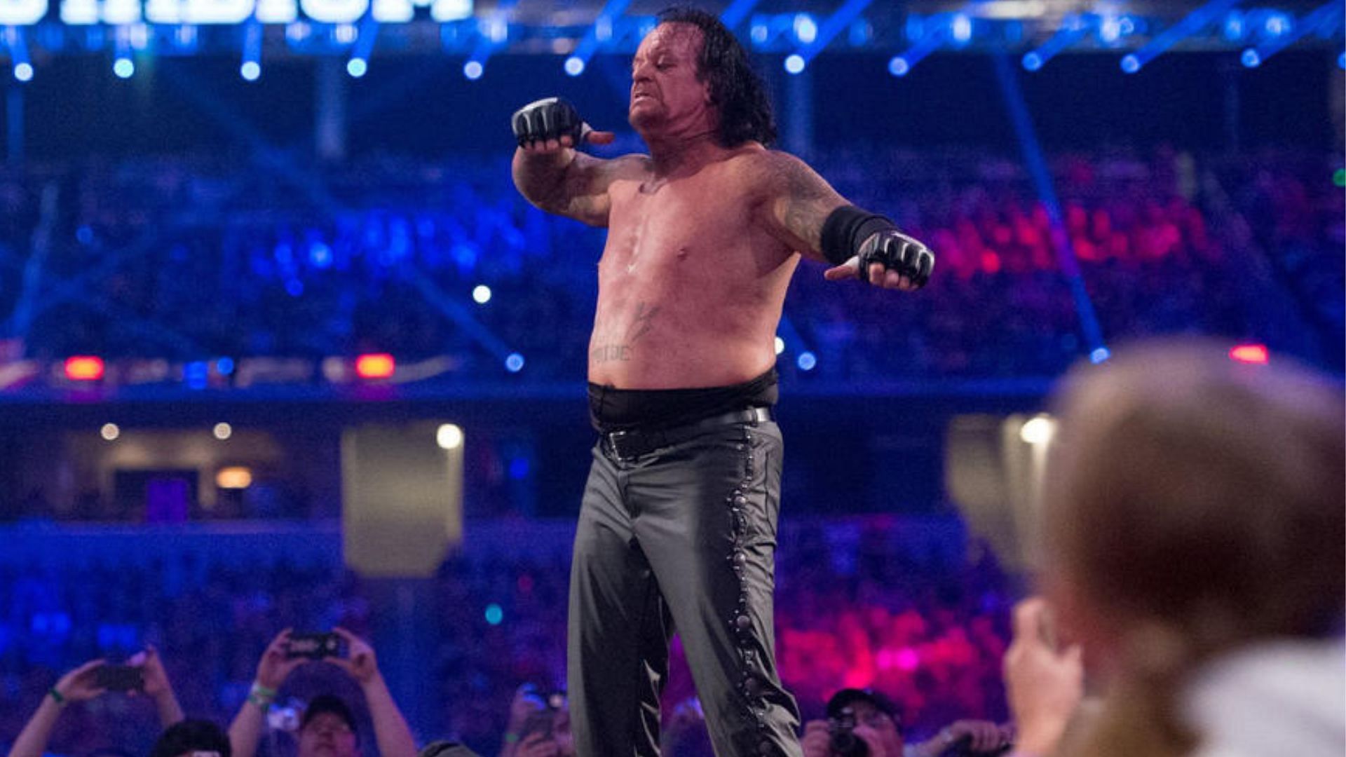 Featured image for "The Undertaker's Potential Return and Royal Rumble Torch Passing Speculation"