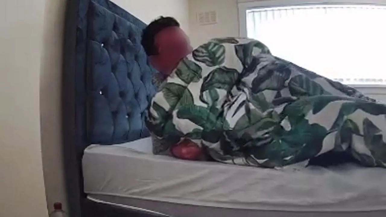 Shocking Security Footage Captures Stranger Sleeping in Woman's Bed